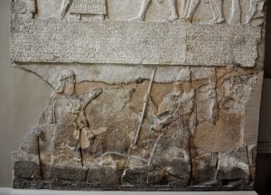 Tiglath-pileser_III_stands_over_an_enemy,_bas-relief_from_the_Central_Palace_at_Nimrud.