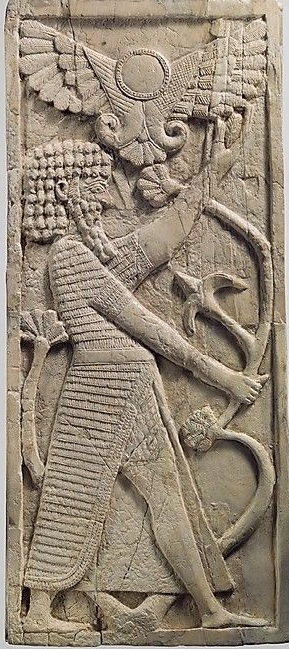 Winged sun over Ashurnasirpal II at Nimrud
