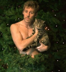 Cat and Shirtless Guy In Christmas Tree